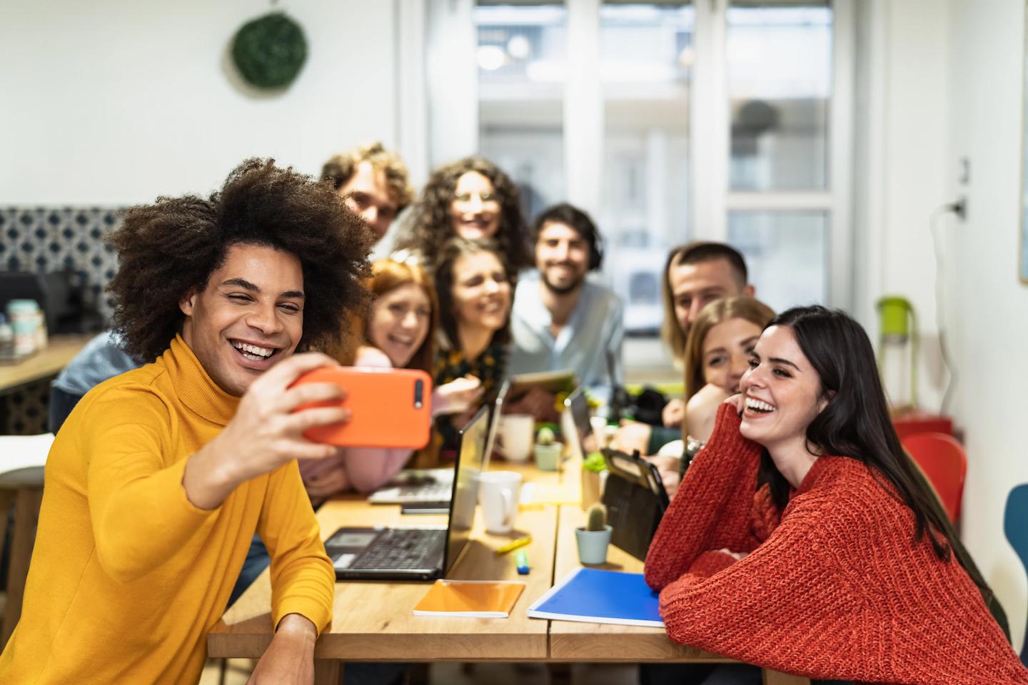 young-people-taking-selfie-with-mobile-smartphone-2021-12-20-21-50-24-utc-1